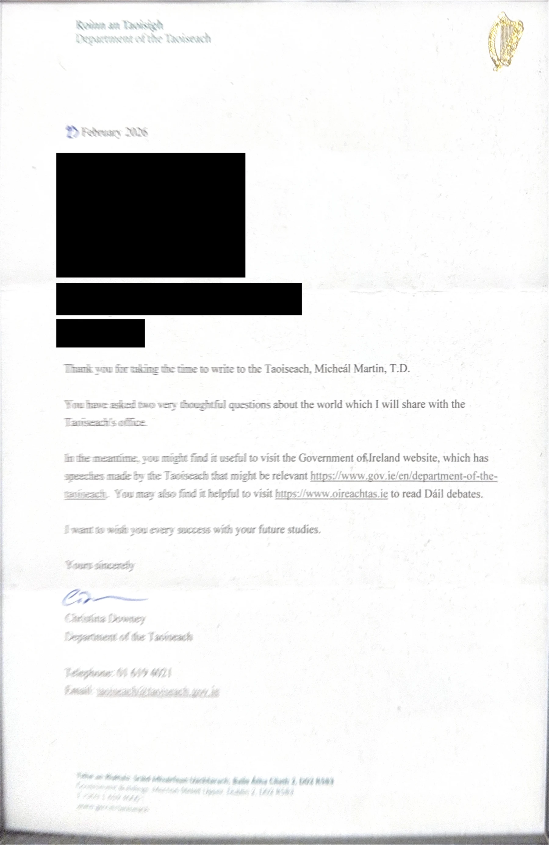Page 1 of the scanned reply to Micheál Martin, with personal details redacted